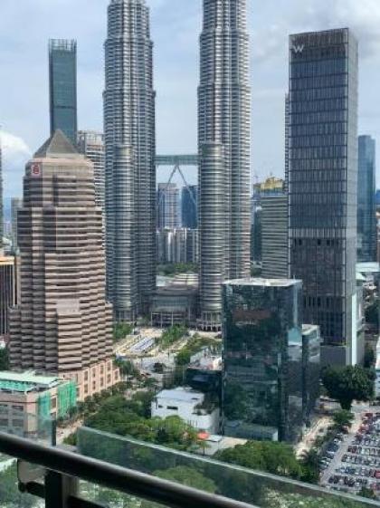 Legasi whitish twin tower view next to LRT train - image 2